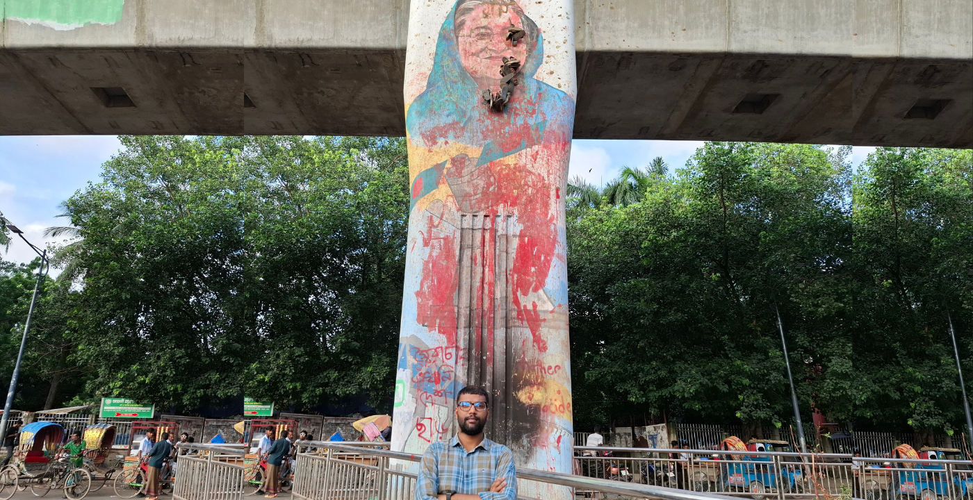 A photo of the author in front of the Dhaka University campus, one of the main sites of the student movement. Photo: Rifat Bin Latif