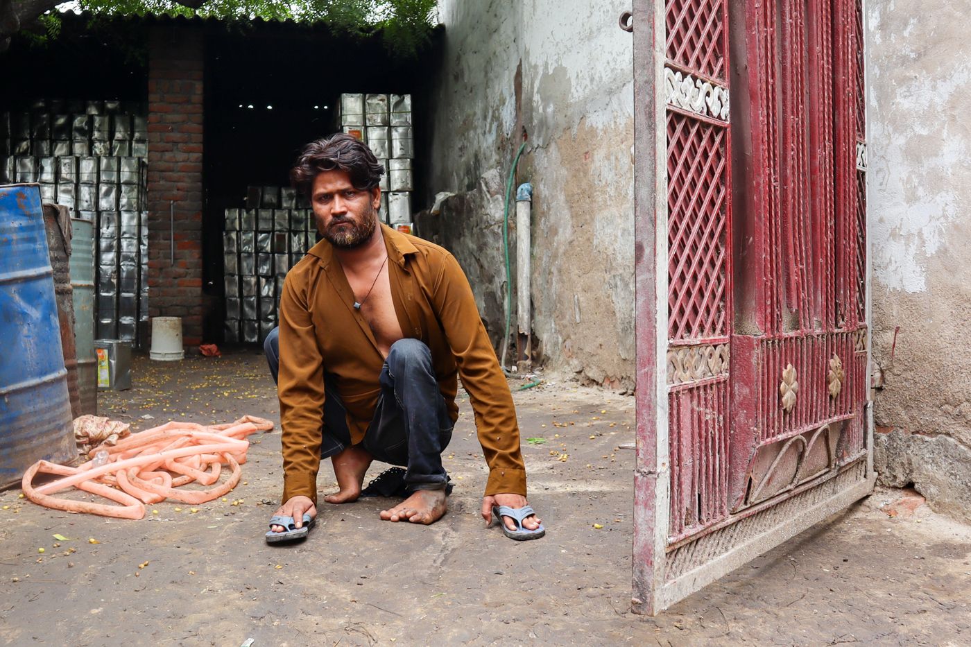 This is an image of Waseem sitting in his courtyard. 