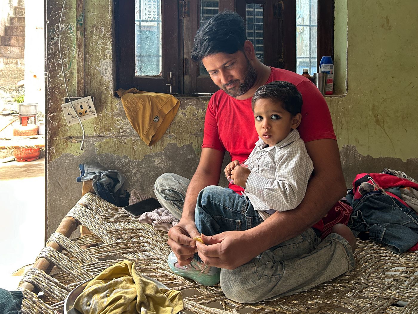 This is a photo of Waseem with his son Mohommad Azhar.