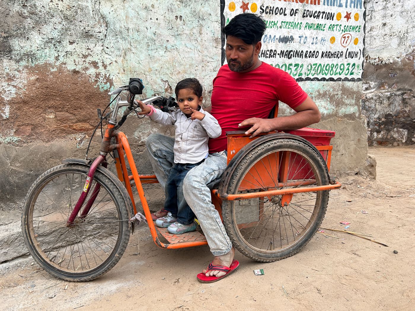 This is a photo of Waseem on his motorised tricycle. 