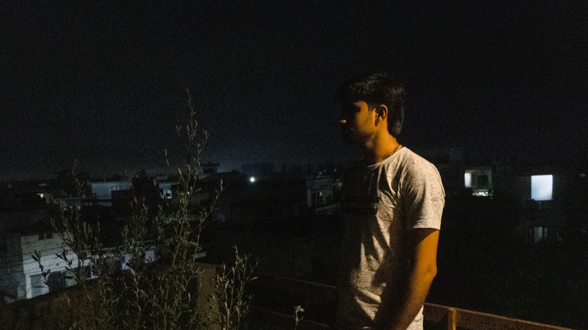 An image of Sumit standing on his terrace. 