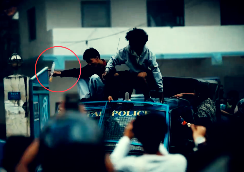 Protesters, seen carrying petrol, appear in a hijacked police vehicle after seizing a police station in Kathmandu. This image was captured from a video found on social media.